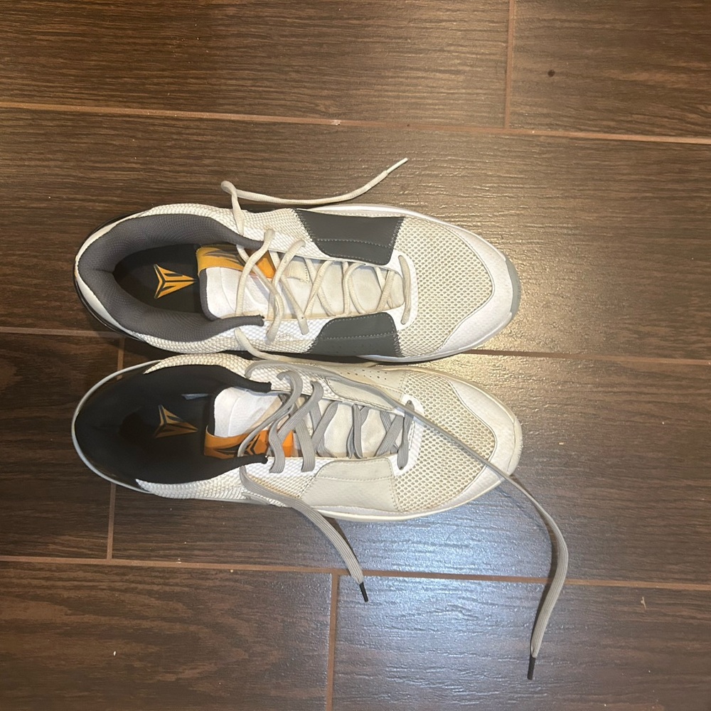 Nike White and Black Athletic Shoes with Gold Accents